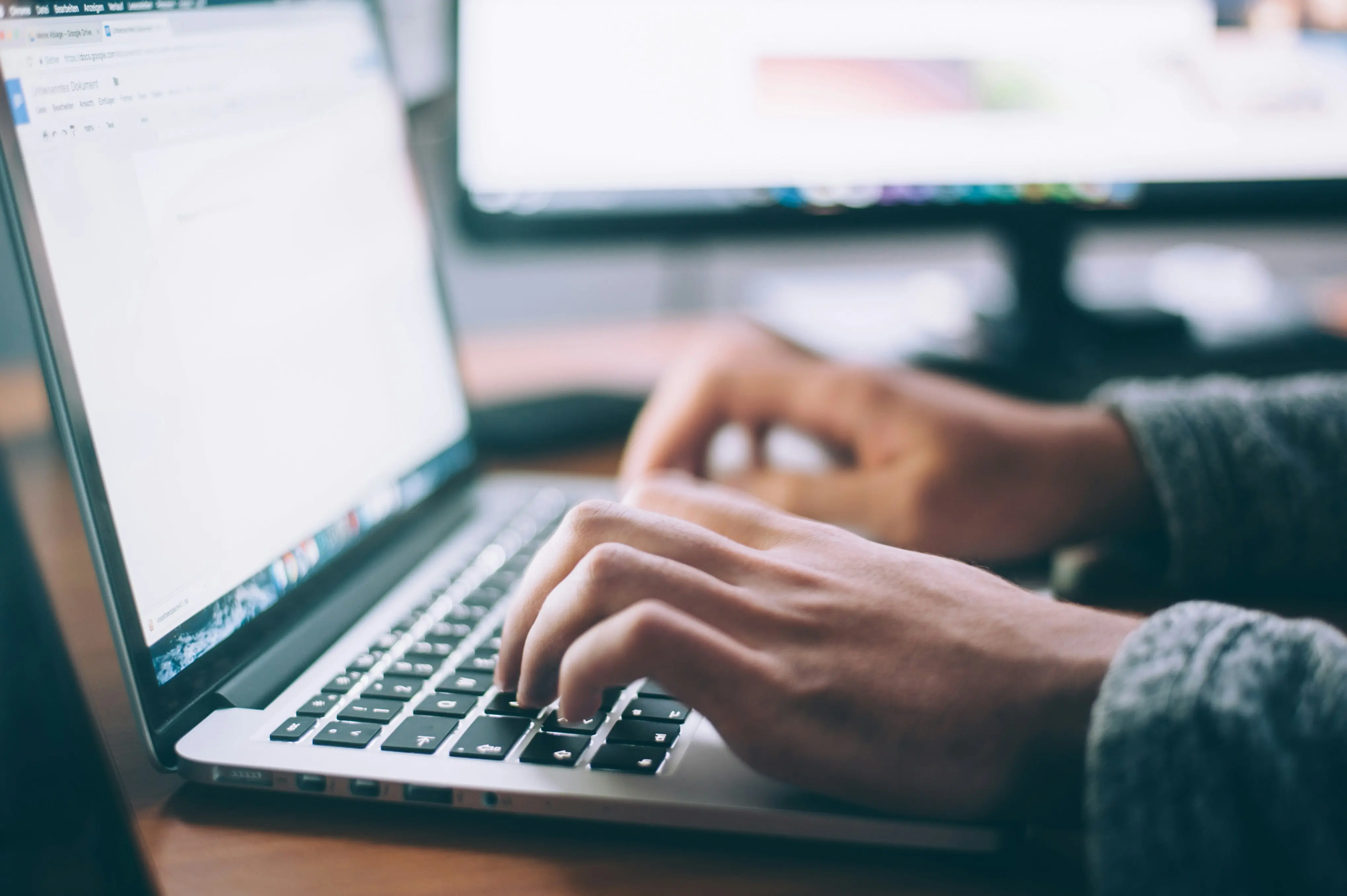 Professional working on a laptop, background investigation research