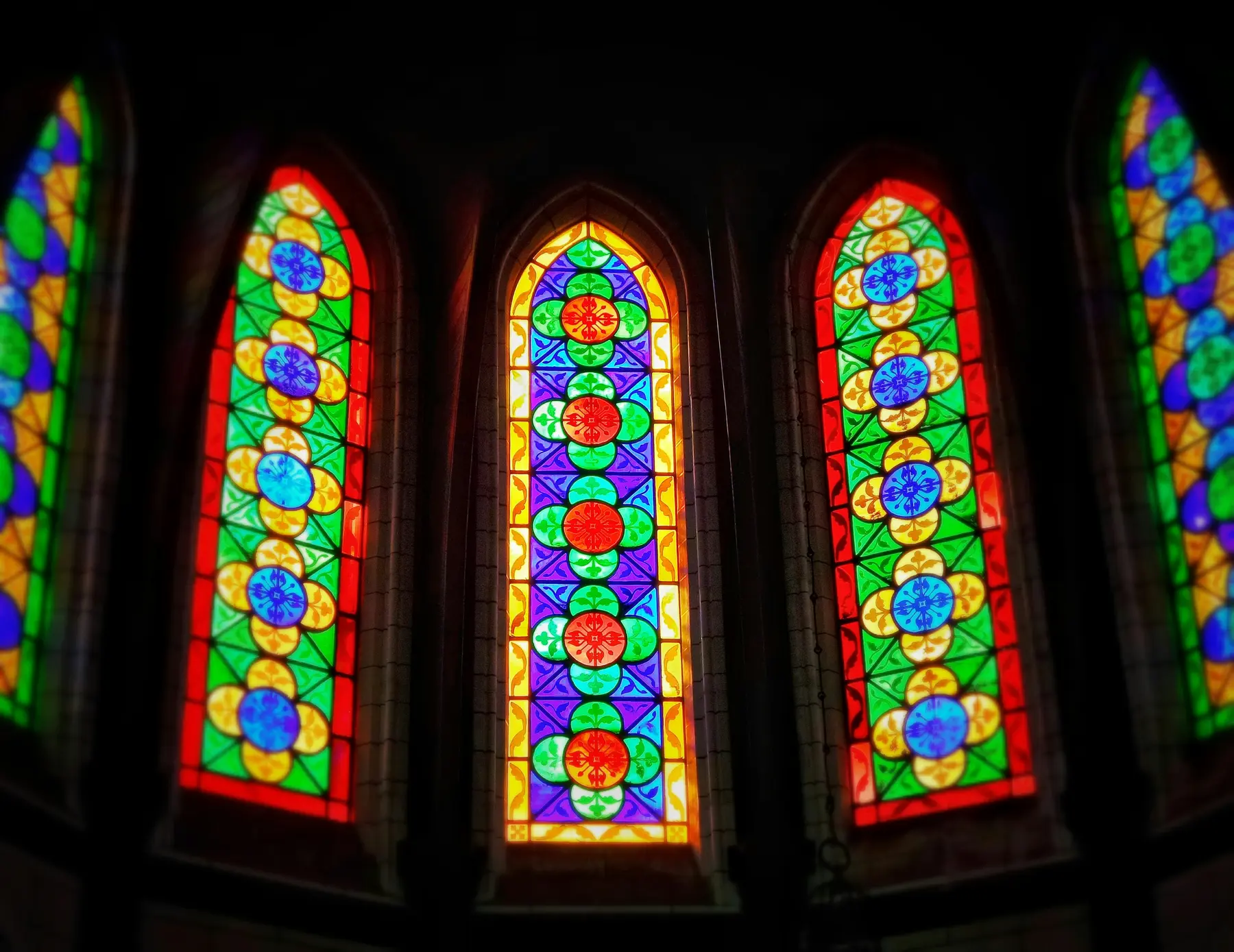 Colorful stained glass windows in a house of worship